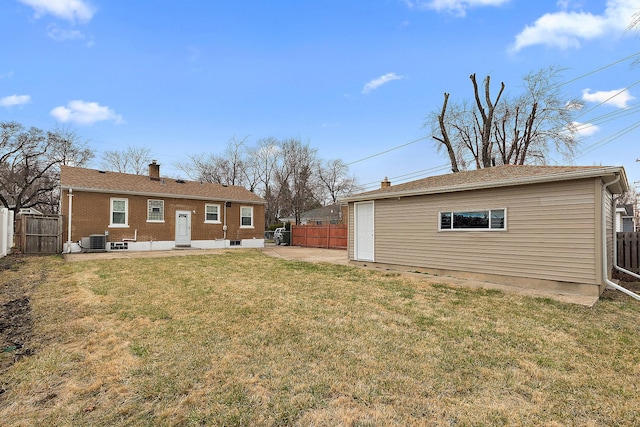 1521 N Wolf Rd, Berkeley, IL 60163 - rear view of property with a patio area, central air condition unit, a chimney, and brick siding