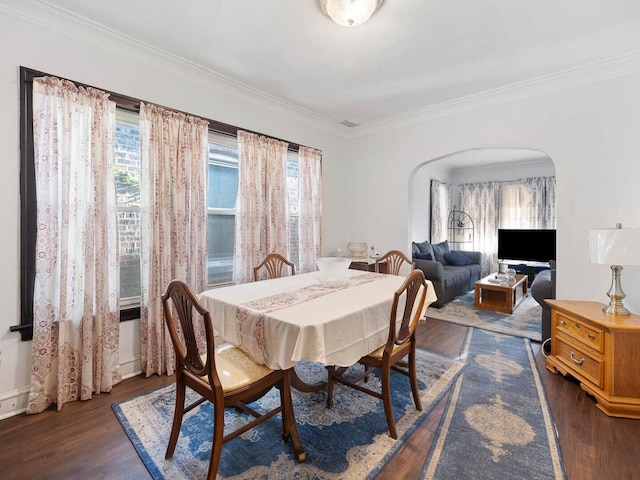 8423 S Paulina St, Chicago, IL 60620 - dining room featuring arched walkways, dark wood-style floors, healthy amount of natural light, and crown molding