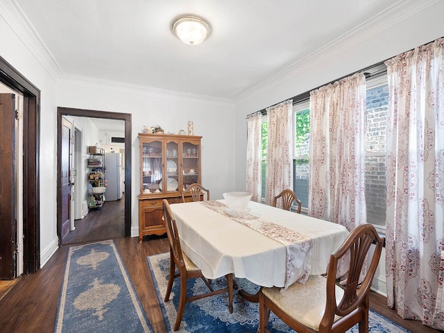 8423 S Paulina St, Chicago, IL 60620 - dining space featuring dark wood finished floors, crown molding, and baseboards