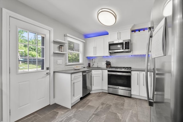 4401 Kingston Ave, Lisle, IL 60532 - kitchen featuring stainless steel appliances, a sink, healthy amount of natural light, and dark countertops
