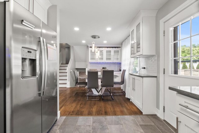4401 Kingston Ave, Lisle, IL 60532 - kitchen with stainless steel refrigerator with ice dispenser, white cabinetry, backsplash, glass insert cabinets, and recessed lighting