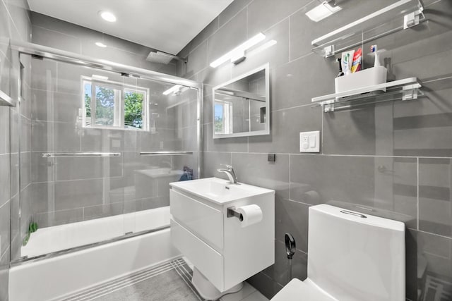 4401 Kingston Ave, Lisle, IL 60532 - full bath featuring tile walls, toilet, bath / shower combo with glass door, vanity, and backsplash