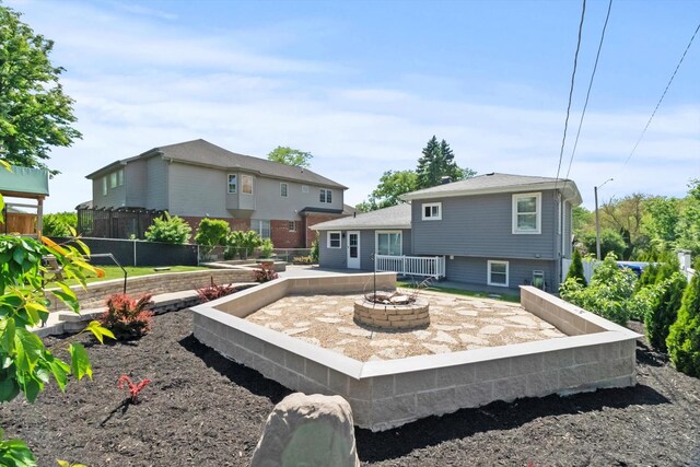 4401 Kingston Ave, Lisle, IL 60532 - back of house featuring an outdoor fire pit