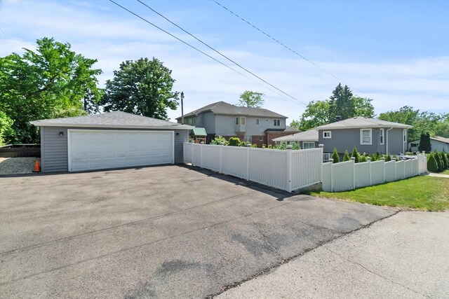 4401 Kingston Ave, Lisle, IL 60532 - view of front of home with a detached garage and an outbuilding