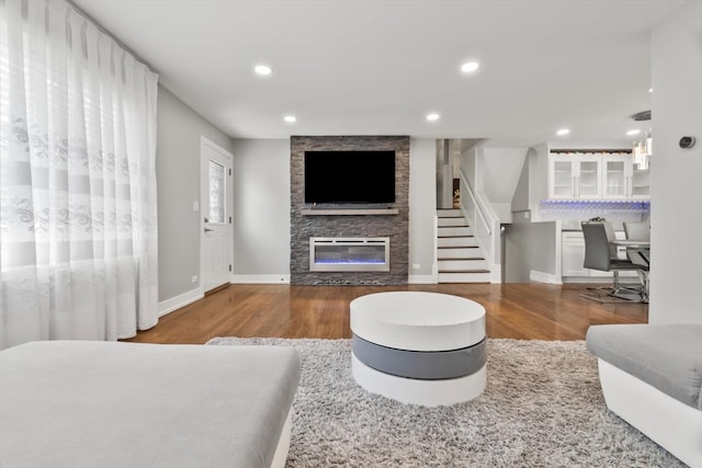 4401 Kingston Ave, Lisle, IL 60532 - living area with wood finished floors, a fireplace, recessed lighting, baseboards, and stairway