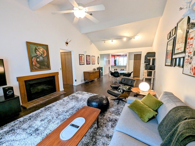 2176 Harbortown Cir Unit 2176, Champaign, IL 61821 - living room featuring beam ceiling, a tiled fireplace, wood finished floors, a ceiling fan, and high vaulted ceiling