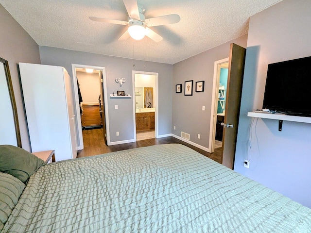 2176 Harbortown Cir Unit 2176, Champaign, IL 61821 - bedroom featuring wood finished floors, a textured ceiling, baseboards, connected bathroom, and ceiling fan