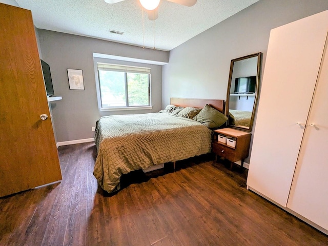 2176 Harbortown Cir Unit 2176, Champaign, IL 61821 - bedroom with wood finished floors, a textured ceiling, ceiling fan, and baseboards