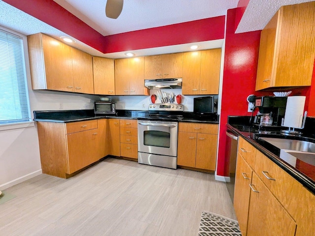 2176 Harbortown Cir Unit 2176, Champaign, IL 61821 - kitchen with stainless steel electric range oven, under cabinet range hood, light wood-type flooring, baseboards, and dark countertops