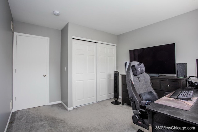 carpeted office space with baseboards