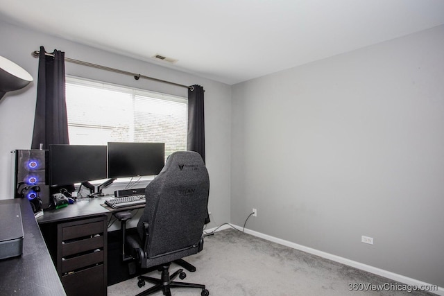 office area with light carpet and baseboards