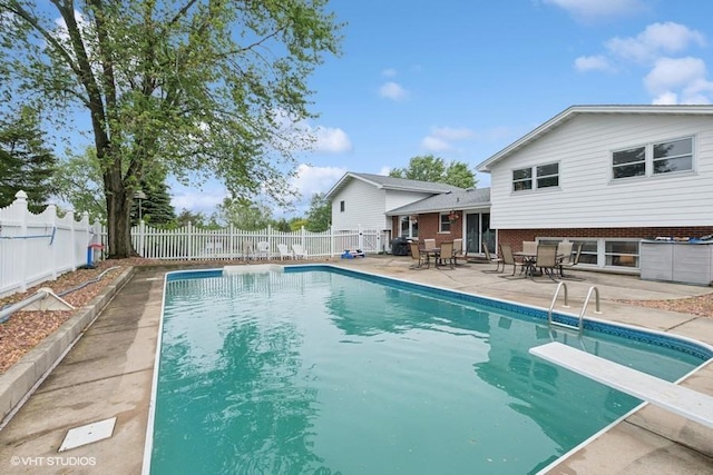 18457 Virginia Ln, Mokena, IL 60448 - view of pool featuring a patio, a fenced backyard, a diving board, and outdoor dining space