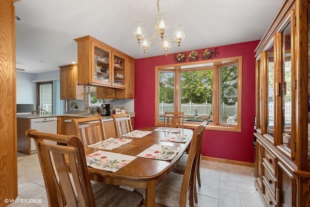 18457 Virginia Ln, Mokena, IL 60448 - dining room featuring light tile patterned floors, a chandelier, and baseboards