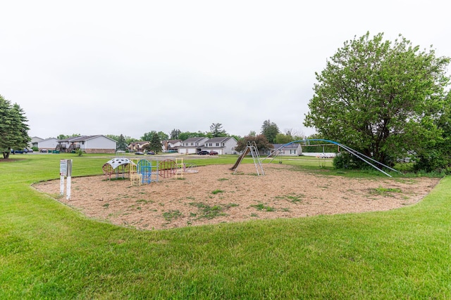 1409 E Stonehenge Dr Unit 1409, Sycamore, IL 60178 - communal playground featuring a lawn
