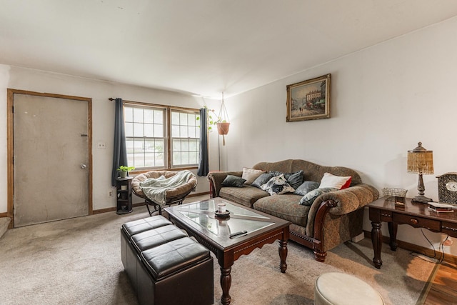 1409 E Stonehenge Dr Unit 1409, Sycamore, IL 60178 - living area featuring baseboards and light carpet
