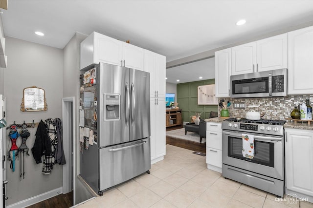 521 N Elm St, Hillside, IL 60162 - kitchen featuring stainless steel appliances, white cabinetry, backsplash, and recessed lighting