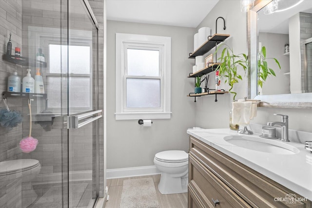 521 N Elm St, Hillside, IL 60162 - bathroom with toilet, a shower stall, vanity, and baseboards
