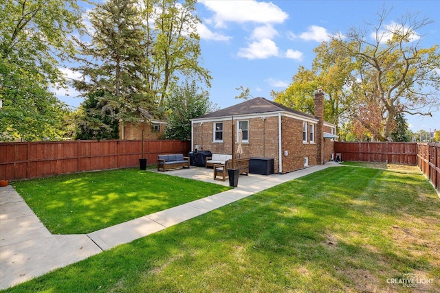 521 N Elm St, Hillside, IL 60162 - back of property featuring a chimney, outdoor lounge area, brick siding, and a patio area