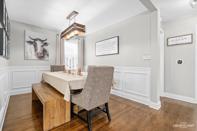 521 N Elm St, Hillside, IL 60162 - dining space with dark wood-style floors, wainscoting, and a decorative wall