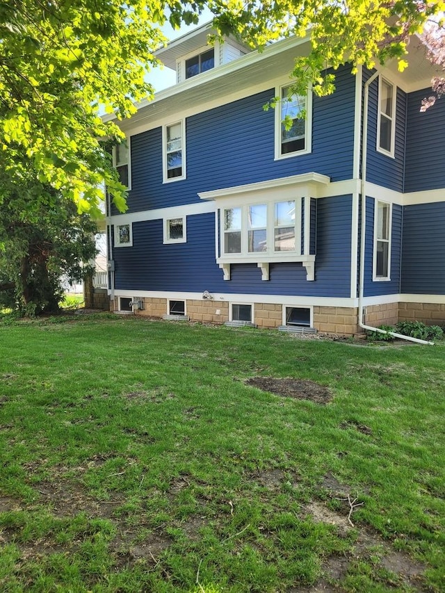 442 High St, Buda, IL 61314 - rear view of house with a lawn