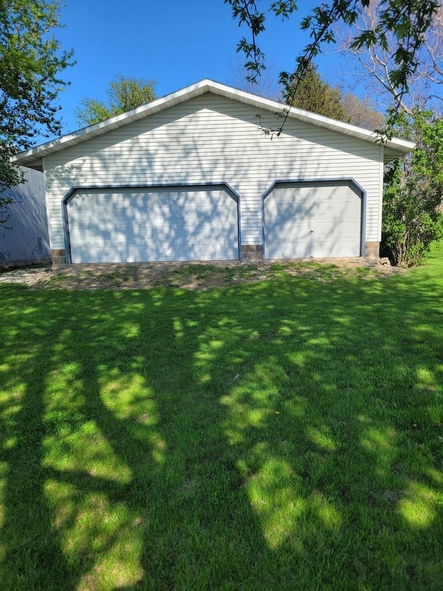 442 High St, Buda, IL 61314 - view of side of property with a yard and a garage