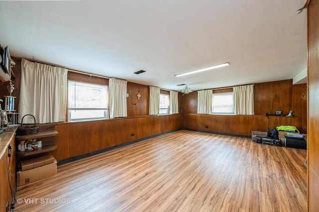 130 W Natalie Ln, Addison, IL 60101 - empty room with wooden walls and wood finished floors