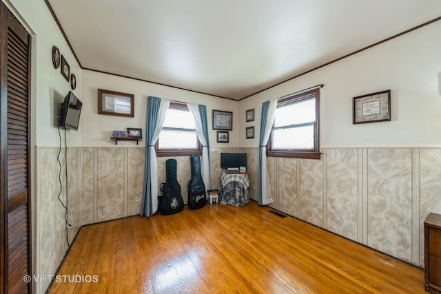130 W Natalie Ln, Addison, IL 60101 - spare room featuring wood finished floors and a wainscoted wall