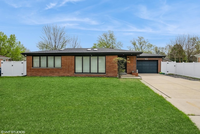 489 Good Ave, Des Plaines, IL 60016 - view of front facade with a gate, concrete driveway, brick siding, and an attached garage