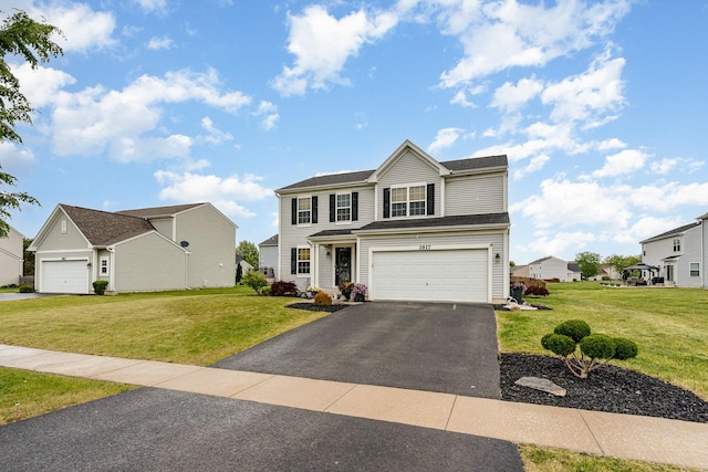 3917 Kristen Ct, Plano, IL 60545 - traditional home featuring driveway, a garage, and a front yard