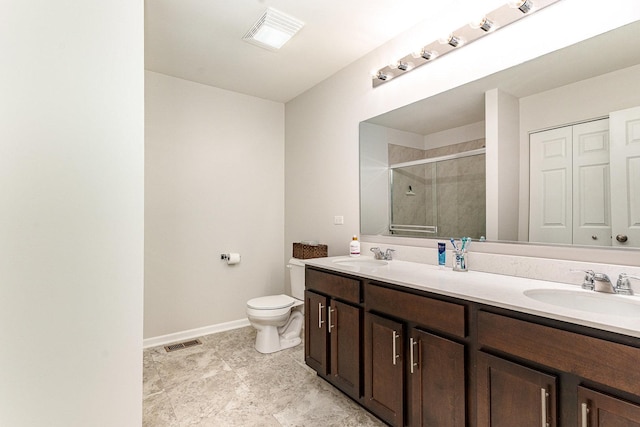 3917 Kristen Ct, Plano, IL 60545 - bathroom with a stall shower, toilet, double vanity, and baseboards