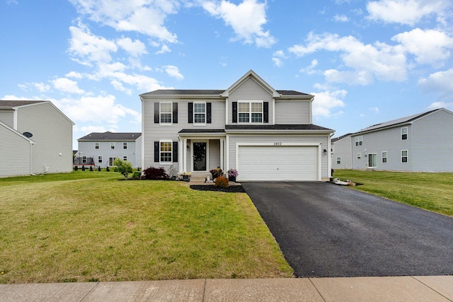 3917 Kristen Ct, Plano, IL 60545 - traditional-style home featuring driveway, an attached garage, and a front lawn