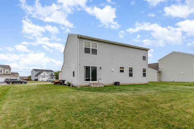 3917 Kristen Ct, Plano, IL 60545 - rear view of property with a yard