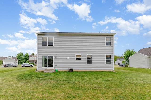3917 Kristen Ct, Plano, IL 60545 - rear view of house with a yard