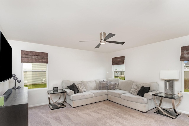 3917 Kristen Ct, Plano, IL 60545 - living room featuring carpet flooring, ceiling fan, and baseboards