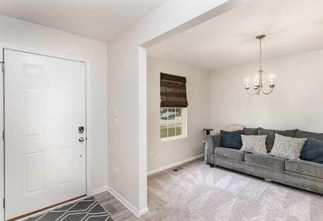 3917 Kristen Ct, Plano, IL 60545 - foyer with a chandelier and baseboards