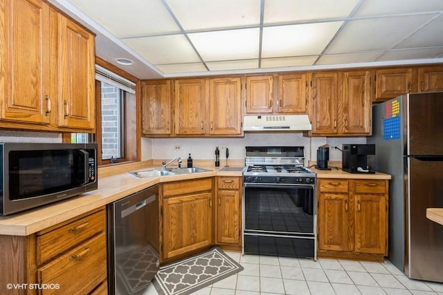 6437 Oak Forest Ave Unit 1E, Tinley Park, IL 60477 - kitchen featuring stainless steel appliances, a sink, under cabinet range hood, and light countertops