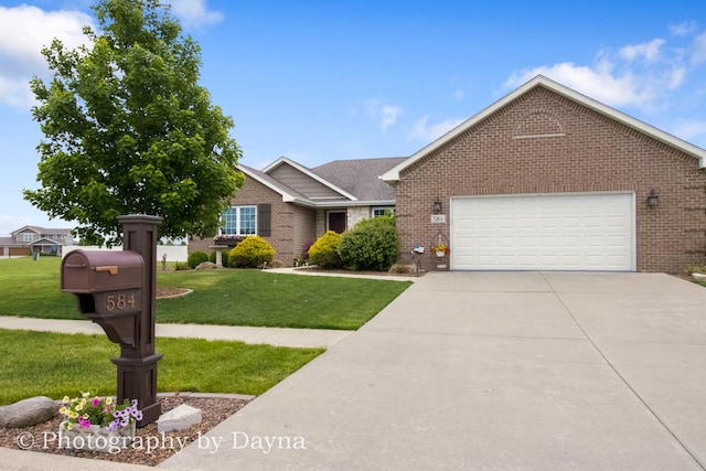 584 Chase Ct, Bourbonnais, IL 60914 - single story home with brick siding, driveway, a front lawn, and a garage