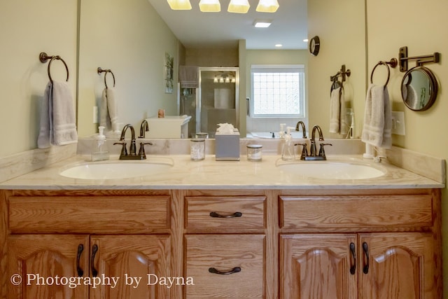 584 Chase Ct, Bourbonnais, IL 60914 - bathroom featuring a stall shower and double vanity