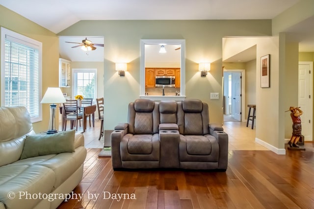 584 Chase Ct, Bourbonnais, IL 60914 - living area with a ceiling fan, vaulted ceiling, dark wood-type flooring, and baseboards