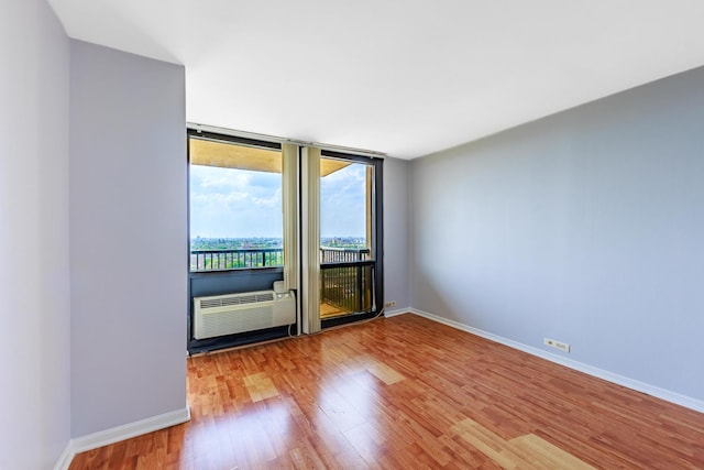 2901 S Michigan Ave Unit 1706, Chicago, IL 60616 - unfurnished room featuring wood finished floors and baseboards