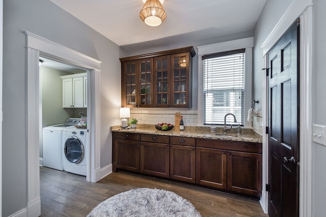 549 S Main St, Naperville, IL 60540 - washroom featuring washing machine and dryer, cabinet space, dark wood-style floors, and baseboards
