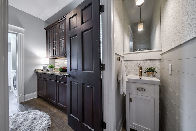 549 S Main St, Naperville, IL 60540 - bathroom with vanity, wood finished floors, and backsplash