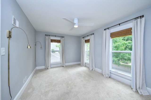 549 S Main St, Naperville, IL 60540 - carpeted spare room with baseboards and a ceiling fan