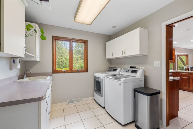 60 Romiga Ln, Palos Park, IL 60464 - laundry area with cabinet space, washing machine and clothes dryer, light tile patterned flooring, and baseboards