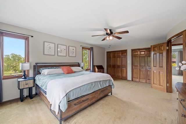 60 Romiga Ln, Palos Park, IL 60464 - bedroom featuring two closets, light carpet, ceiling fan, and baseboards