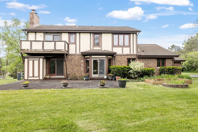 60 Romiga Ln, Palos Park, IL 60464 - back of property with a balcony, a chimney, a patio, and a yard