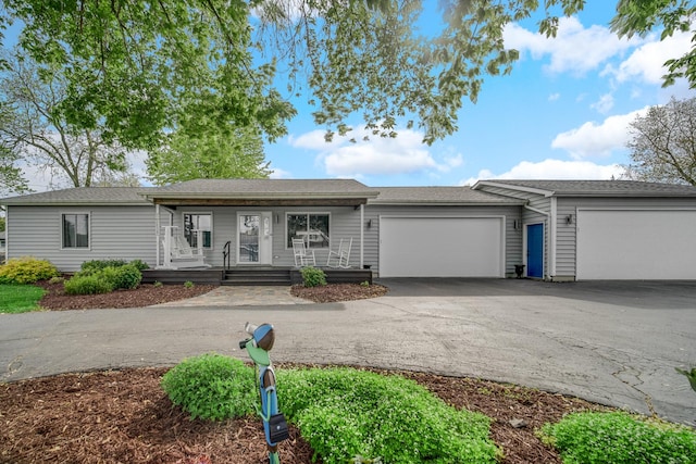 26238 W Hickory Ln, Ingleside, IL 60041 - single story home featuring asphalt driveway, a garage, and a porch