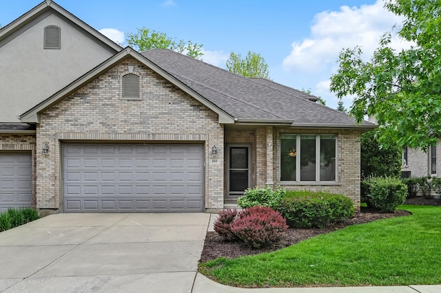 740 Fairmont Ct, Westmont, IL 60559 - view of front of home featuring an attached garage, driveway, brick siding, roof with shingles, and a front yard