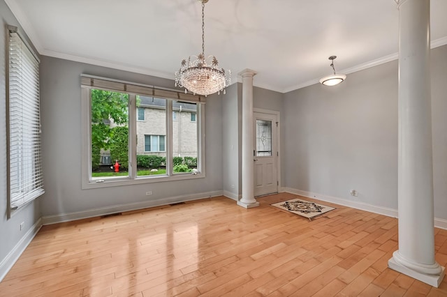 740 Fairmont Ct, Westmont, IL 60559 - unfurnished dining area with decorative columns, light wood finished floors, baseboards, a chandelier, and ornamental molding