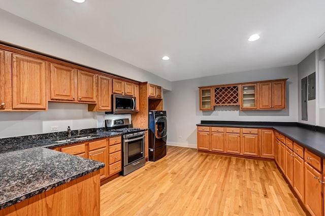740 Fairmont Ct, Westmont, IL 60559 - kitchen featuring stainless steel appliances, washer / dryer, a sink, light wood-style flooring, and glass insert cabinets